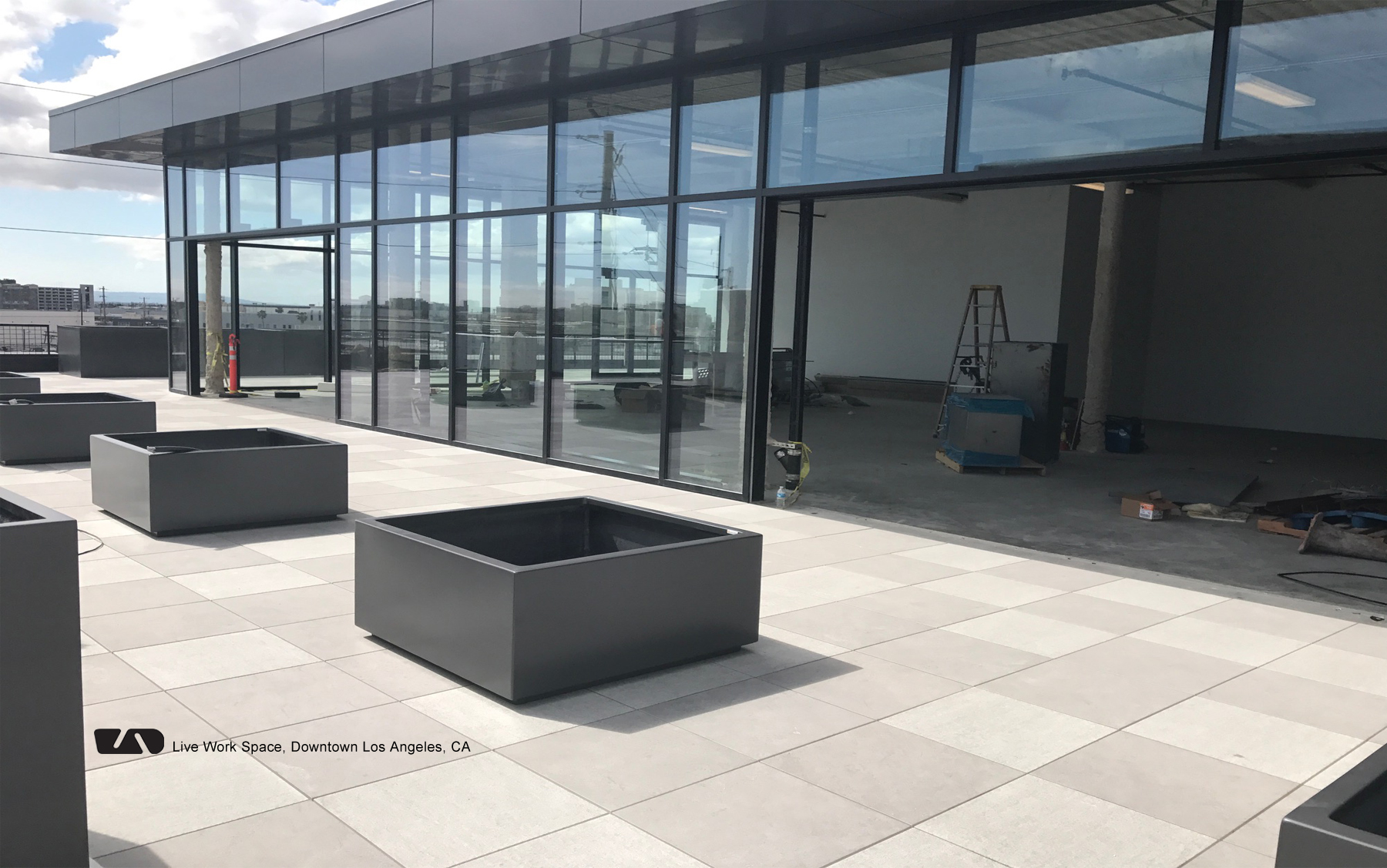 <h1 class="text-white">Pedestal and pavers with lightweight planters make a roof deck functional</h1>