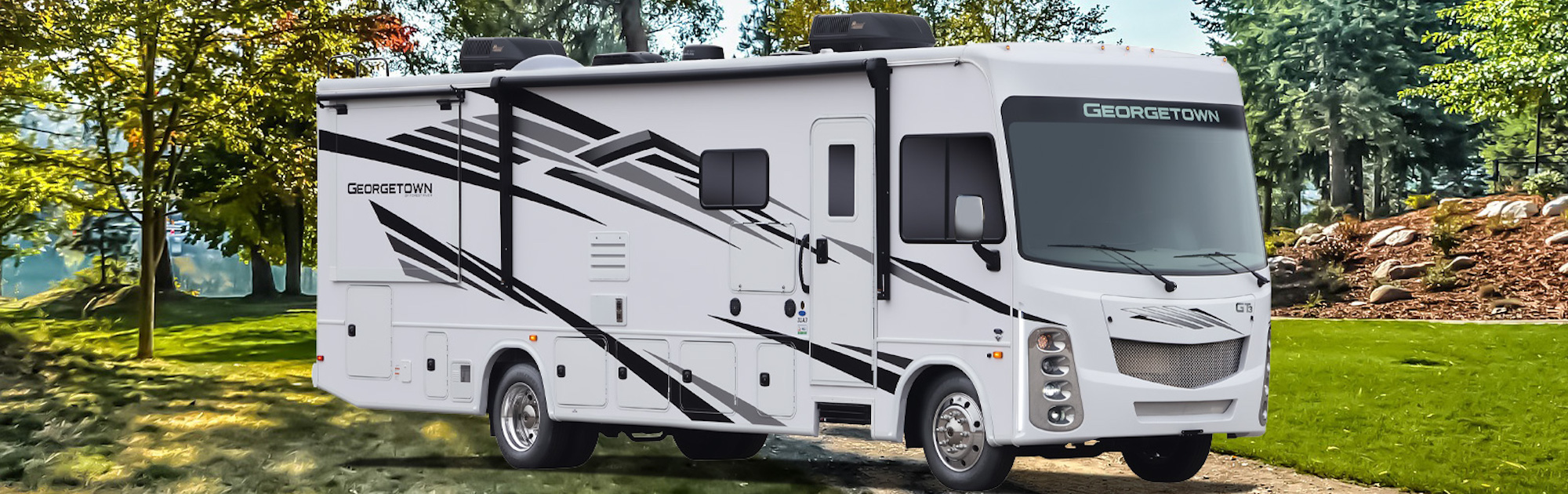 <a href="http://clients.webstager.com/rosmanrv.com/new-forest-river-rvs-in-bc/"><img src="images/upload/January_2022/0-Forest-River-Georgetown-Class-A-Motorhome-Penticton-BC.jpeg"alt="An exterior image of a 2022 Forest River Georgetown Class A Motorhome parked on a grassy campsite with trees, rocks and mulch-covered hills in the background"/></a>