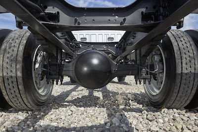 Close-up of the undercarriage of a 2022 Ford F-650, showing its wheels and axles.