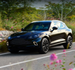 2021 Aston Martin DBX in black flying down country road in Canada