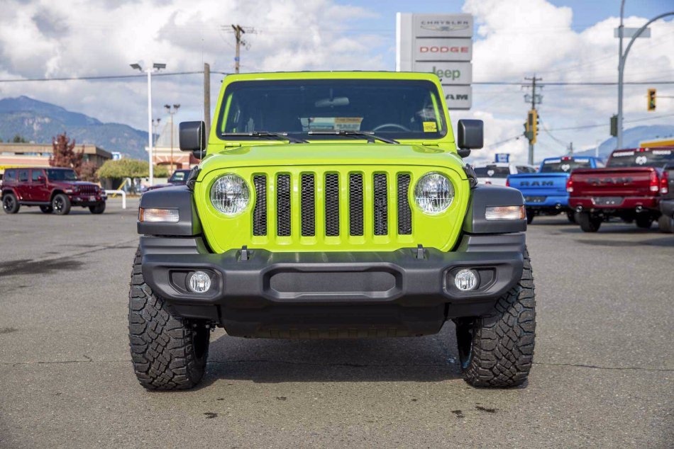 A Green 2021 Jeep Wrangler Unlimited Sport S