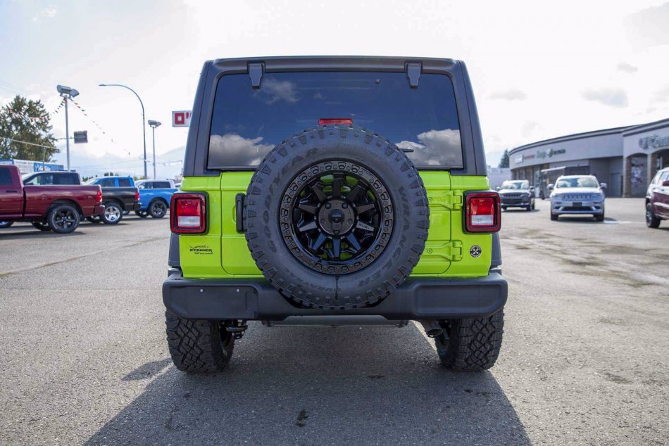 A Green 2021 Jeep Wrangler Unlimited Sport S