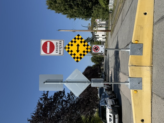 Traffic barrier and restricted access sign on a residential street