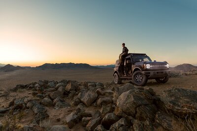 <a href="https://www.fordpartsbc.ca"><img src="https://clients.webstager.com/skahaford.com/images/upload/December_2021/Ford_Parts_BC/FAQs/FordBrocno.jpg"alt="2021 Ford Bronco with a person sitting not he roof in the desertâ€/></a>