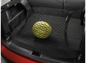 Image of a Las-Stik Cargo Net in the back of a Ford trunk, holding a watermelon.