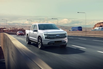 <a href="https://clients.webstager.com/skahaford.com/2022-ford-f150-lightning-truck-in-canada/"><img src="images/upload/July_2021/commercial_news/2022-ford-f150-lightning.jpg"alt="A photo of a 2022 F-150 Lightning driving on a divided highway showing the truck's front and right-hand side with some other cars and a partly-cloudy sky near sunset visible in the background."/></a>