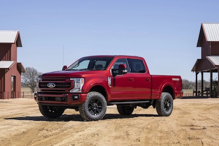 <a href="https://clients.webstager.com/skahaford.com/2021-ford-f250-in-bc"><img src="images/upload/March_2022/CN-5-2022-ford-f-250-tremor-exterior-penticton-bc.jpg"alt="A red 2021 Ford F-250 truck with the optional Tremor Package parked on dirt-covered ground with barns in the background"/></a>