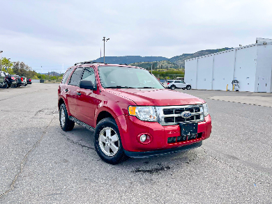 <a href="https://clients.webstager.com/skahaford.com/inventory/#/?&orderBy=6&asc=1&t=0&filter=[Used%2C%2C%2C%2C%2C0%2C%2C%2C15000%2C%2C%2C%2C%2C%2C%2C%2C%2C%2C%2C%2C%2C]"><img src="/images/upload/May_2021/2011_ford_escape.jpg"alt="Red 2011 Ford Escape parked in dealership lot"/></a>